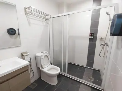 a bathroom with a shower and a toilet and a sink at D'Ocean Marina Laguna Resort by Manhattan Group in Lumut