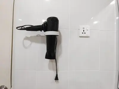 a black umbrella hanging on a wall in a bathroom at D'Ocean Marina Laguna Resort by Manhattan Group in Lumut