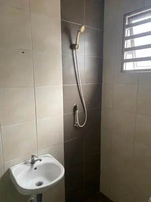 a bathroom with a sink and a shower at Budget Homestay Lahat in Ipoh