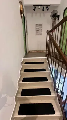 a set of stairs in a room at Raintown House in Taiping
