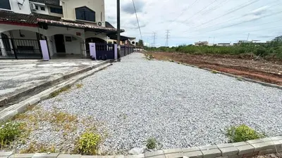 a gravel road in front of a house at Raintown House in Taiping