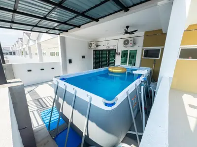 a large swimming pool in a house at NDD Homestay in Sitiawan