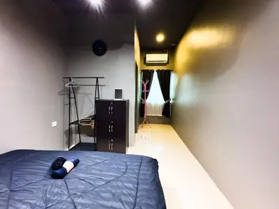 a room with a bed in a room with lights at NDD Homestay in Sitiawan