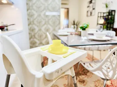 a white dining table with a yellow hat on it at Georgetown near Gurney and Straits Quay Seaview with Netflix and Washer Dryer in George Town