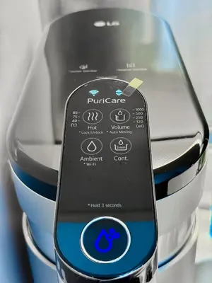 a remote control sitting on top of a blender at Georgetown near Gurney and Straits Quay Seaview with Netflix and Washer Dryer in George Town