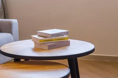 a stack of books sitting on top of a table at Iconic Regency by Stellar ALV in Bayan Lepas