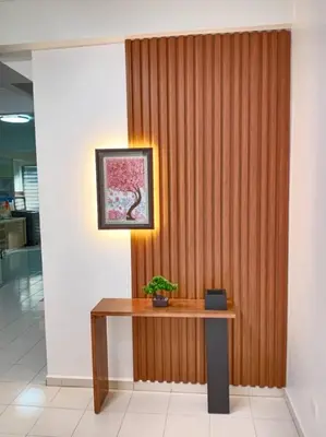 a wooden wall with a table with a plant on it at Cheerfull-Cozy Japanese Style in Bukit Mertajam