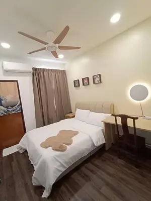a bedroom with a bed and a ceiling fan at Cheerfull-Cozy Japanese Style in Bukit Mertajam