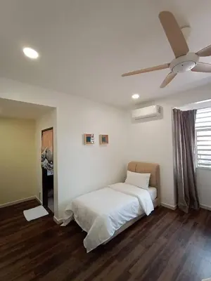 a bedroom with a white bed and a ceiling fan at Cheerfull-Cozy Japanese Style in Bukit Mertajam
