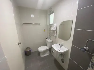a white bathroom with a toilet and a sink at Anderson Residency Ipoh Wifi Pool Islam in Ipoh