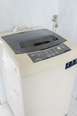 a washing machine with a sink on top of it at Eastern Apt, Jelutong in Jelutong