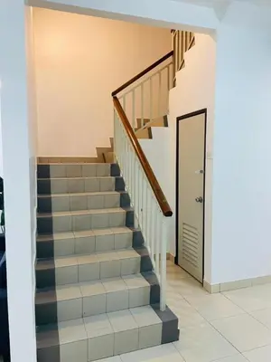 a staircase in a house with a door at Bayan Homestay Bayan Lepas Penang in Bayan Lepas