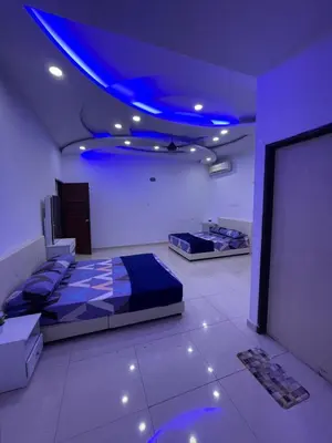 a room with two beds and a blue ceiling at 6 Rooms Budget 3 Tingkat USM Gelugor Georgetown in Gelugor