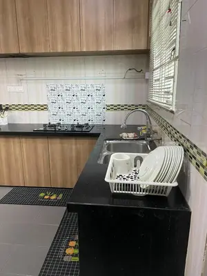 a kitchen with a sink and a dish rack at 6 Rooms Budget 3 Tingkat USM Gelugor Georgetown in Gelugor
