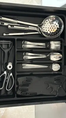 a drawer full of utensils in a black box at IPOH City Centre ICC Suites by HWC in Ipoh