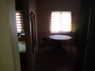 a small room with a table and a window at Santai Salai Homestay and Cafe in Kepala Batas