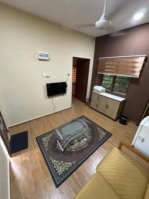 a living room with a tub in the middle of a room at Santai Salai Homestay and Cafe in Kepala Batas