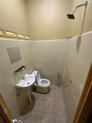 a bathroom with a toilet and a sink at Santai Salai Homestay and Cafe in Kepala Batas