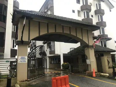 an entrance to a building with orange chairs in a parking lot at Rayyan'Homestay PARKVIEW in Tanah Rata