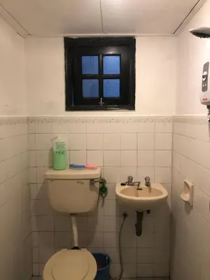 a bathroom with a toilet and a sink at Rayyan'Homestay PARKVIEW in Tanah Rata