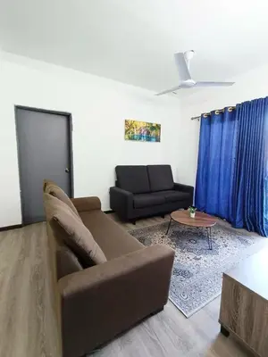 a living room with a couch and a table at IRDINA HomestayMuslim's 2 at Emerald Avenue Brinchang Centrum in Brinchang