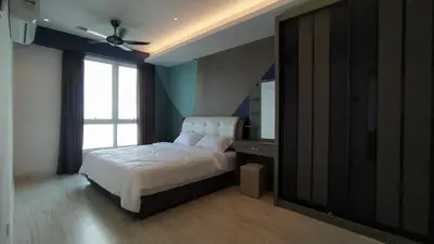 a bedroom with a large bed and a window at Mansion One 279 in George Town