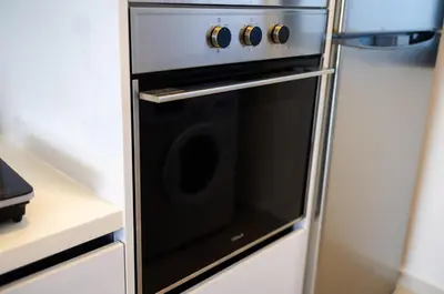 a kitchen with a black oven in a kitchen at Beacon Suites #Georgetown #FamilyStay #13A #Cozy in George Town