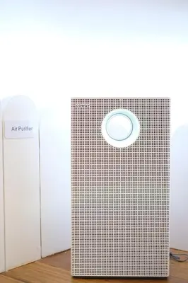 an air purifier is sitting on a wooden floor at Tung Kidcove Centrum Cameron in Brinchang