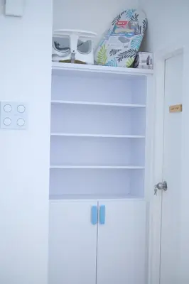 a shelf above a white door with shoes on it at Tung Kidcove Centrum Cameron in Brinchang