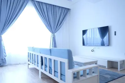 a baby room with a crib and a tv at Tung Kidcove Centrum Cameron in Brinchang