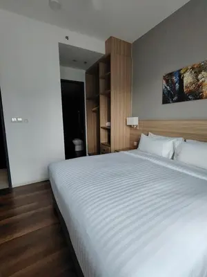 a bedroom with a large white bed in it at ThemeParkview-Sunway Onsen-2br2b in Ipoh