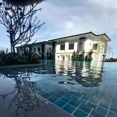 a house with a pool of water in front of a house at ThemeParkview-Sunway Onsen-2br2b in Ipoh