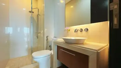 a bathroom with a sink and a toilet and a shower at Straits Quay Highest & Spacious Seaview Suite - 3 in Bagan Jermal