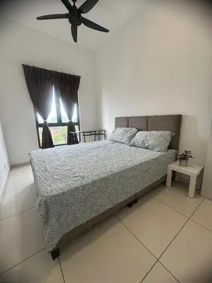 a bedroom with a bed and a ceiling fan at horizon ipoh in Ipoh