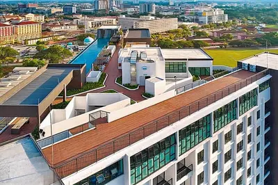 an overhead view of a building with a pool at horizon ipoh in Ipoh