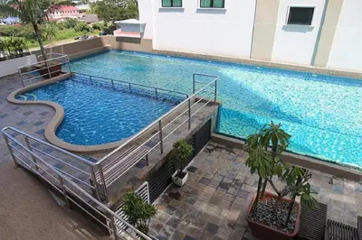 an overhead view of a large swimming pool in a building at Ipoh Kinta Riverfront Air-Con Cozy Home in Ipoh