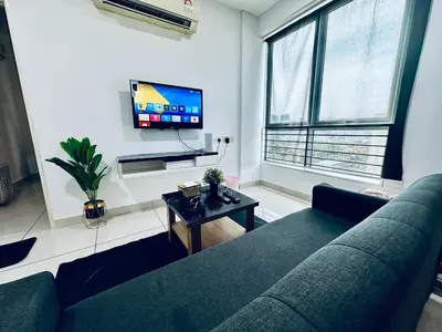 a living room with a couch and a tv at 8pax 2-Bedroom l Seaview l Georgetown l Gleneagles l Mansion One in George Town