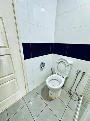 a bathroom with a white toilet in a room at 8pax 2-Bedroom l Seaview l Georgetown l Gleneagles l Mansion One in George Town