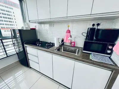 a small kitchen with a sink and a microwave at 8pax 2-Bedroom l Seaview l Georgetown l Gleneagles l Mansion One in George Town