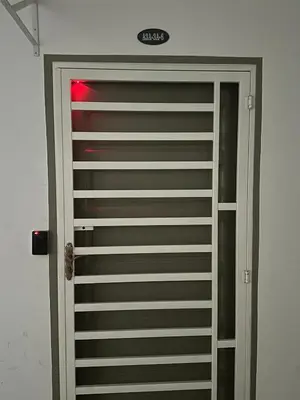 a garage door with a red light on top of it at Family Stay at Quintet A3A-3A-6 in Tanah Rata