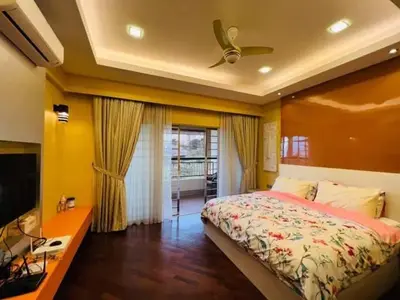 a bedroom with a bed and a ceiling fan at Shamplex Rentals in Kampar