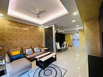 a living room with a couch and a table at Shamplex Rentals in Kampar