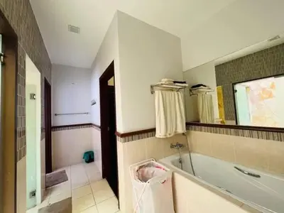 a bathroom with a tub and a sink at Shamplex Rentals in Kampar