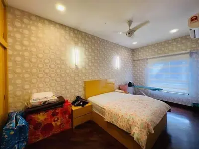 a bedroom with a bed and a window at Shamplex Rentals in Kampar