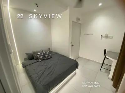 a bedroom with a black bed in a room at 22 Skyview in Bukit Mertajam