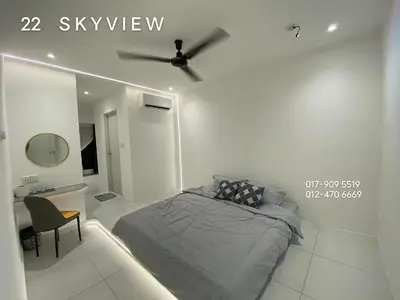 a bedroom with a bed and a ceiling fan at 22 Skyview in Bukit Mertajam