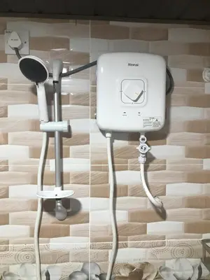 two pictures of a camera and a hair dryer at KK Farm Stay in Ringlet