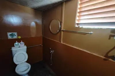 a small bathroom with a toilet and a window at Aeden Villa Roomstay & Homestay in Kuala Kangsar