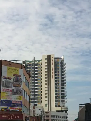 a tall building in the middle of a city at Ipoh town The Majestic Rumi 3R2B 8 paxs in Ipoh