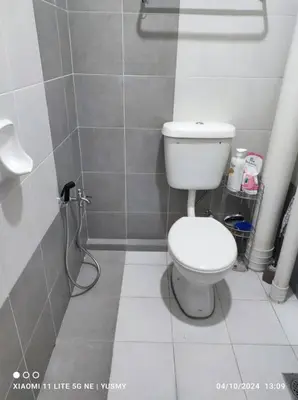 a bathroom with a toilet and a shower at 3 Bedroom Apartment YuCasa Sg Nibong Penang in Bayan Lepas